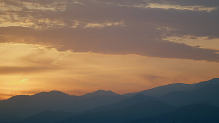 Fantastic Warm Sunrise And Over The Mountain. Range Of Mountain And Sunrise. Real time.