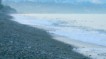 Empty Coastline Pebble Beach. Ocean Waves On Beach. Nature And Relaxation Concept. Static View.