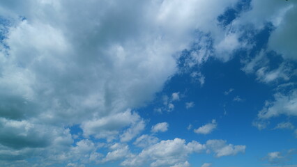 Tiny Fluffy Clouds In Sunny Day. Puffy Fluffy White Clouds. Cumulus Cloud Cloudscape. Atmosphere.