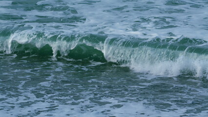 Turquoise Ocean Boiling With Foamy Waves. Sea Waves Crashing. Slow motion.