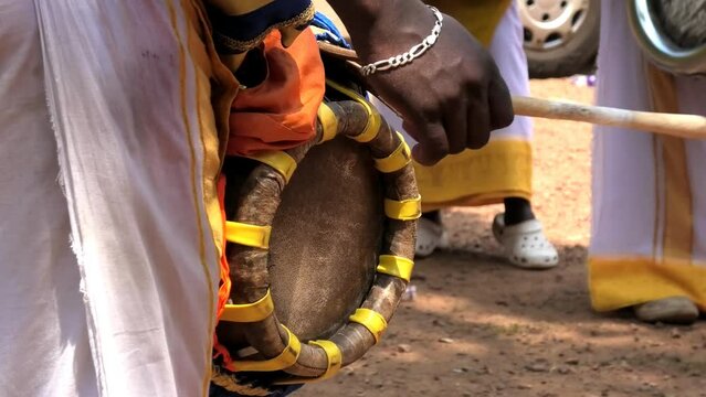 Artist playing Thavil, a South Indian percussion musical instrument	
