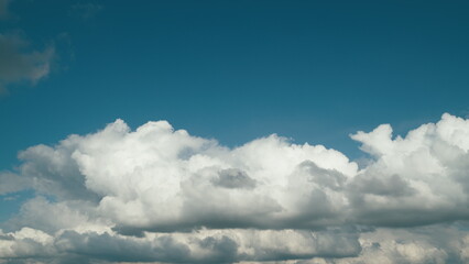 Summer Blue Sky. Layer Of Clouds In Blue Sky Moving. Blue Sky White Clouds. Puffy Fluffy White...