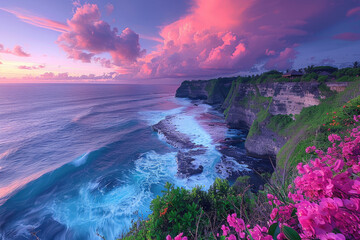 Photo of Uluwatu, Bali, A view from the top overlooking pink clouds and sea with waves crashing...