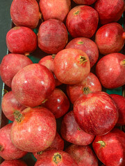Closeup of pomegranates on display at the supermarket.