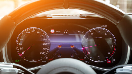 Close up of a car speedometer. Car dashboard with details with indication lamps and instrument...