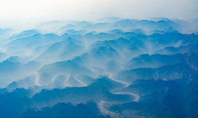 aerial view of mountain range in fog