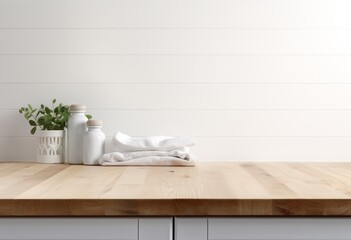Empty wooden table top with blurred white laundry room interior background for product display montage