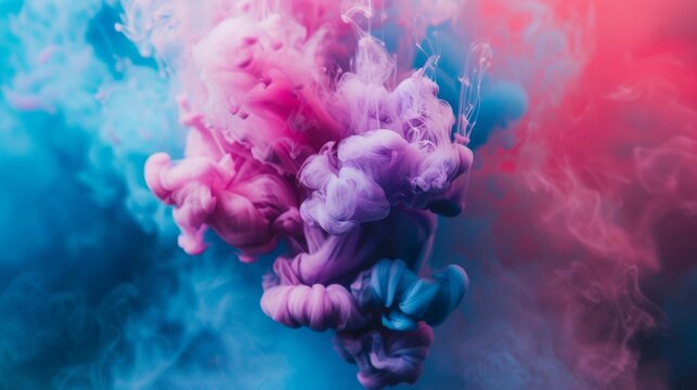 Colorful ink swirls and floats in the air, creating a vibrant and dynamic display of colors