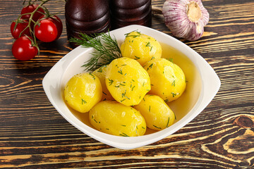 Boiled potato with oil and dill