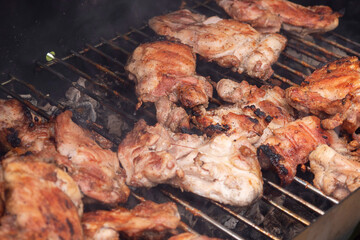 Delicious grilled cuts of meat. Shashlyk, cooking meat on the grill.