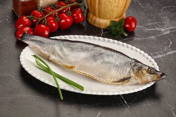 Whole raw salted herring fish