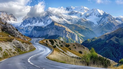 Curving mountain road with hairpin turns and panoramic views of snow-capped peaks in the distance. - obrazy, fototapety, plakaty