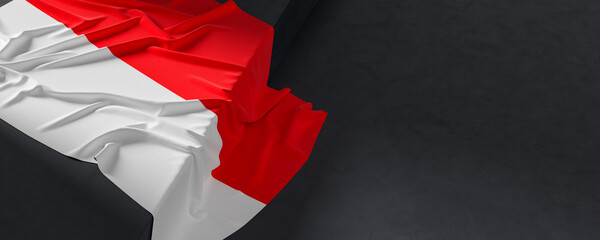 Flag of Indonesia. Fabric textured Indonesia flag isolated on dark background. 3D illustration