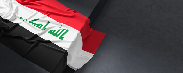 Flag of Iraq. Fabric textured Iraq flag isolated on dark background. 3D illustration