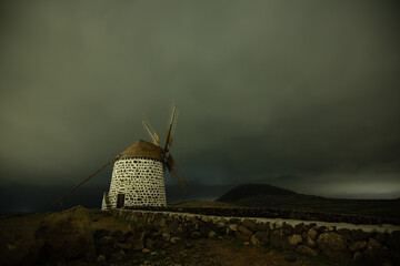 Windmill in a sandstorm at night, Fuerteventura, Canary Islands