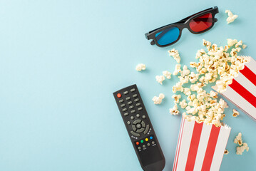 Elevate your movie night: top view of popcorn, 3D glasses, and streaming remote. Movie-themed...