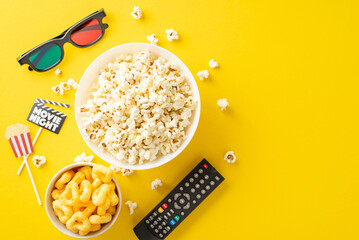 Home premiere with TV app. Top view of popcorn, chips, 3D glasses, remote for online viewing,...