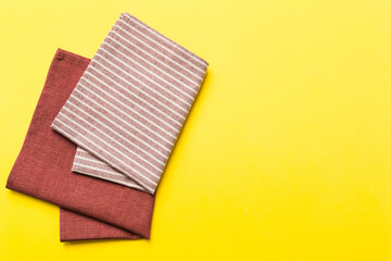 top view with red empty kitchen napkin isolated on table background. Folded cloth for mockup with copy space, Flat lay. Minimal style