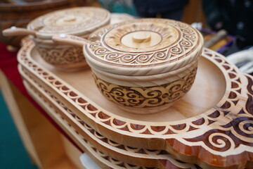 Wooden dishes in the Kazakh national style with ornaments.