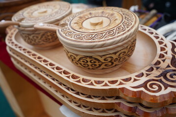 Wooden dishes in the Kazakh national style with ornaments.