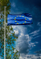 European Union flag. Blue banner with yellow stars