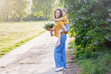 Happy family in the park, enjoying day together on sunset