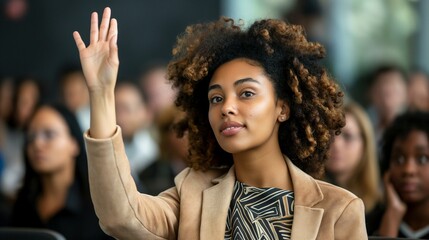 Confident Young Businesswoman Raising Hand at Corporate Seminar