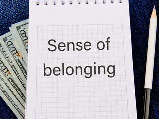 Business, sense of belonging concept. Text Sense of belonging on a notepad against the background...