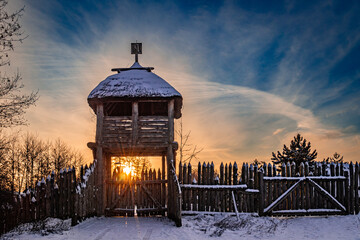 Wooden gate and fort. Winter countryside	
