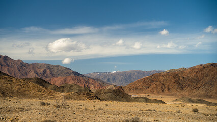 Naklejka premium the spring foothills of the snowy mountains