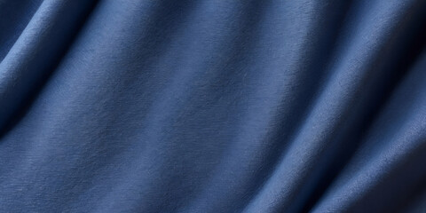 Fototapeta premium A blue fabric with a wavy texture. The fabric is blue and has a shiny appearance. The fabric is smooth and has a slight sheen to it