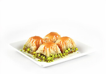 TURKISH BAKLAVA WITH PISTACHIO syrup dessert four slices  isolated on white background