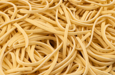 Macro shot texture of dry instant noodles. Raw dried Instant ramen noodles texture background