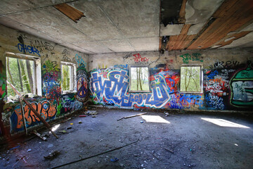 HDR shot of abandoned room vandalized and sprayed