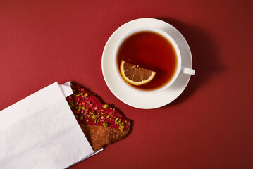 croissant with tea and lemon. top view