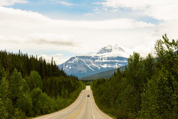 Car driving on Empty Road in the Canadian Rockies, Canada