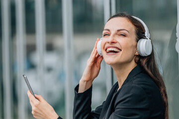 business woman with headphones and phone