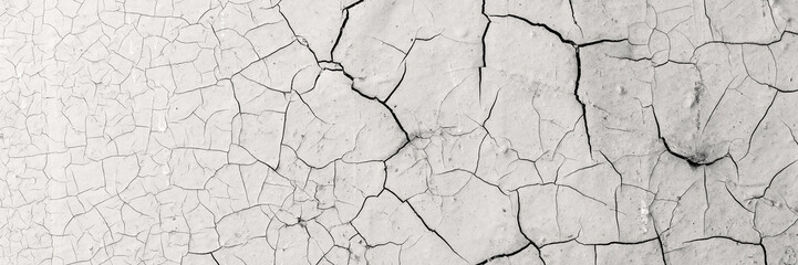 Peeling paint on the wall. Panorama of a concrete wall with old cracked flaking paint. Weathered...