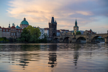 Fototapeta premium Sunrise view of the Charles bridge and Vltava River in Prague