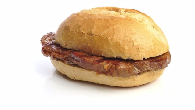 Pork Steak with BBQ Sauce in a Bun on white background