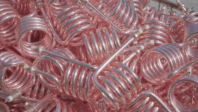 Stacked steel tubes of the heat exchanger. Mass factory production. Heating element.
