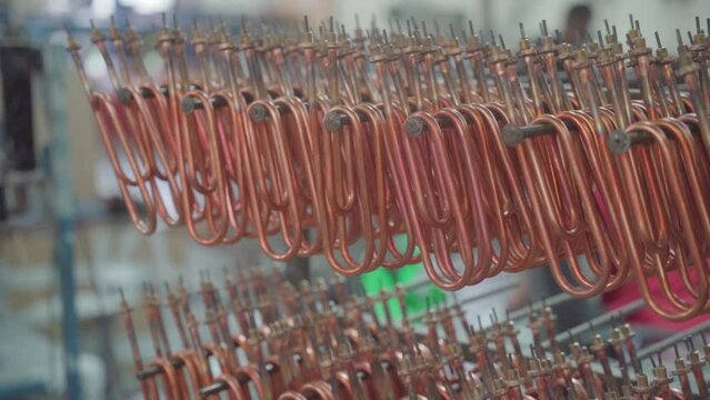 Stacked steel tubes of the heat exchanger. Mass factory production. Heating element.
