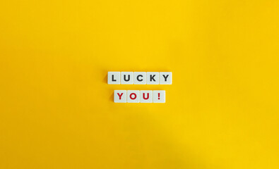 Lucky You Phrase. Text on Block Letter Tiles on Yellow Background. Minimalist Aesthetics.