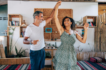 Romantic mature couple dancing with each other on vacation at resort