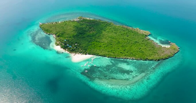 Beach on tropical island and blue sea. Virgin Island, Philippines.