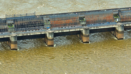 A behemoth on the muddy river, the dam accommodates a railway bridge and strong structures. Its...