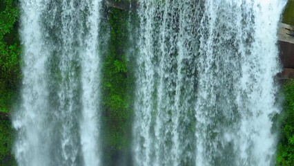 Verdant wonderland: Discover a mesmerizing waterfall hidden amidst a lush, green, and tropical forest, a testament to the enchanting beauty of nature's creations. Huai Luang Waterfall, Thailand.
