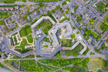 Aerial photo of an old residential building Park Hill Flats currently being regenerated with construction work happening on the building located in the Sheffield city centre in South yorkshire