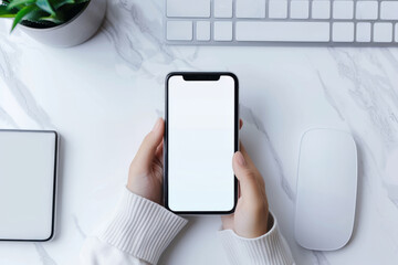 A girl holding a phone with a white screen can evoke associations with communication, the digital world and the use of technology in everyday life. The desktop background adds context, presumably wher