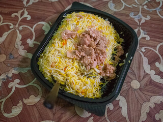 a box of kabsa on the table in capital amman